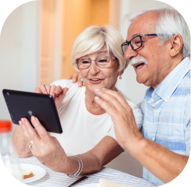 Woman and man looking together at a mobile tablet screen